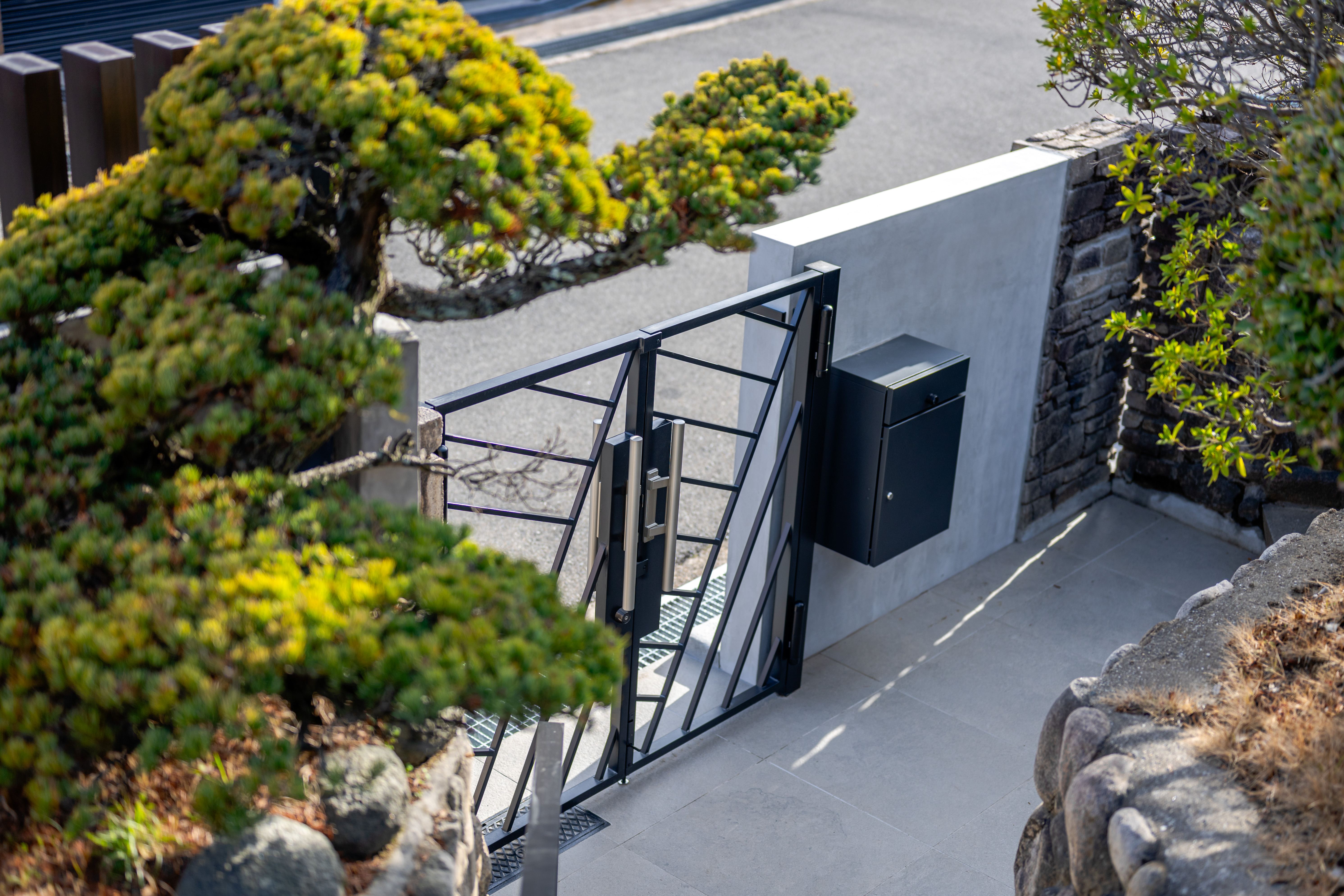 Exterior Renovation with Stonework and Planting
